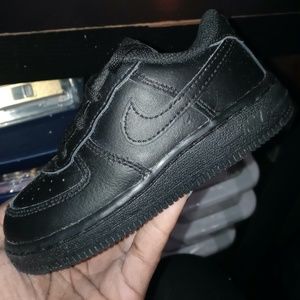 Black low top toddler Air Forces 1s